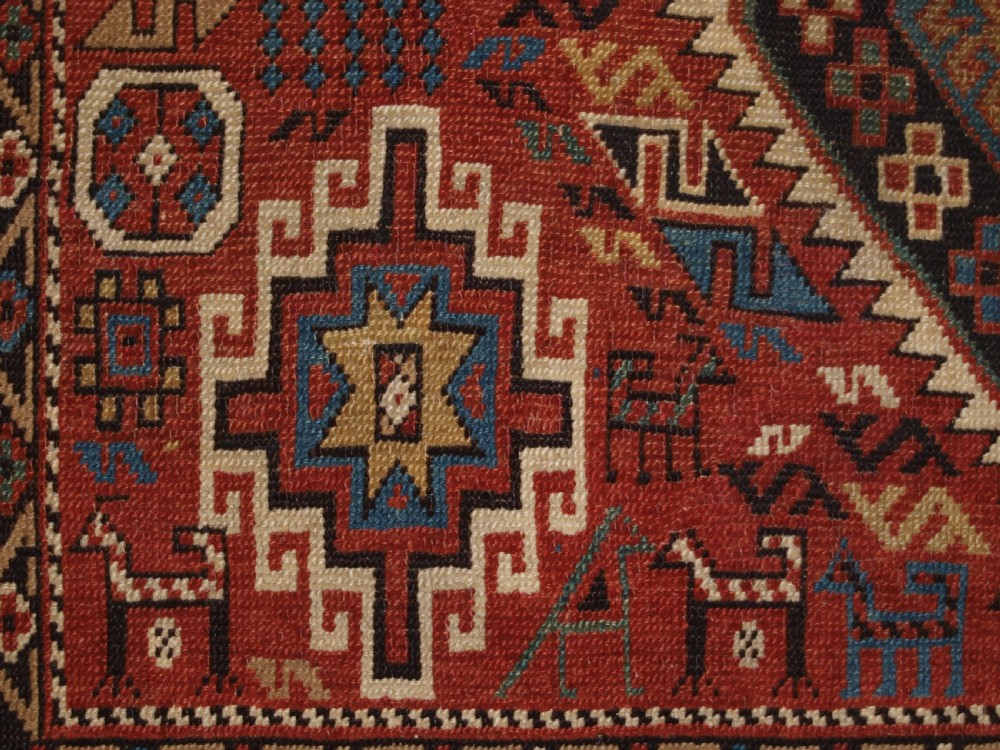 ANTIQUE CAUCASIAN DAGHESTAN RUG, CAMEL, PEOPLE AND ANIMALS, CIRCA 1890 View X