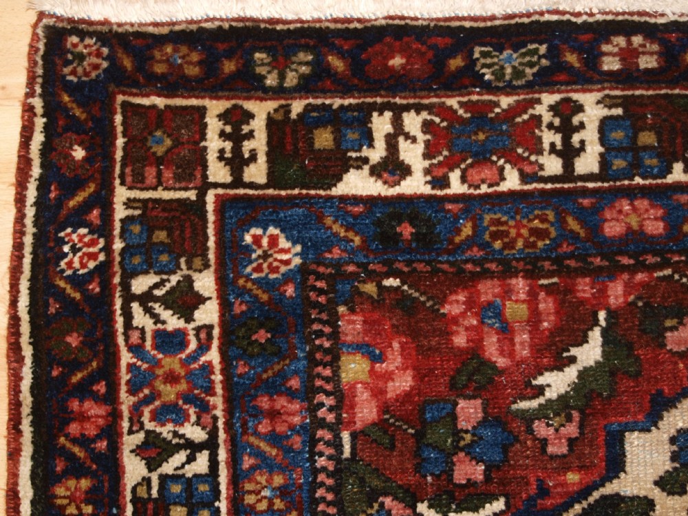 ANTIQUE BAKHTIARI RUG OF VASE AND GARDEN DESIGN, CIRCA 1900/20. View III