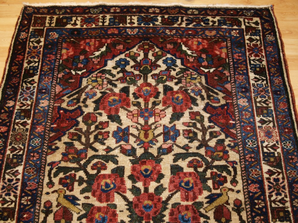 ANTIQUE BAKHTIARI RUG OF VASE AND GARDEN DESIGN, CIRCA 1900/20. View IV