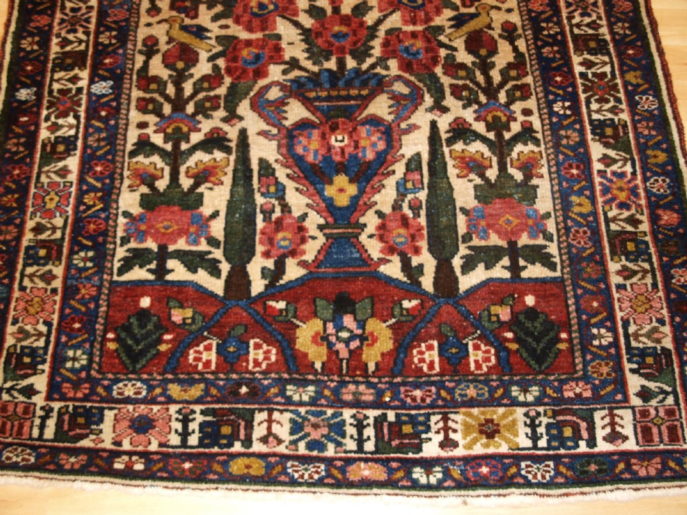 ANTIQUE BAKHTIARI RUG OF VASE AND GARDEN DESIGN, CIRCA 1900/20. View VI