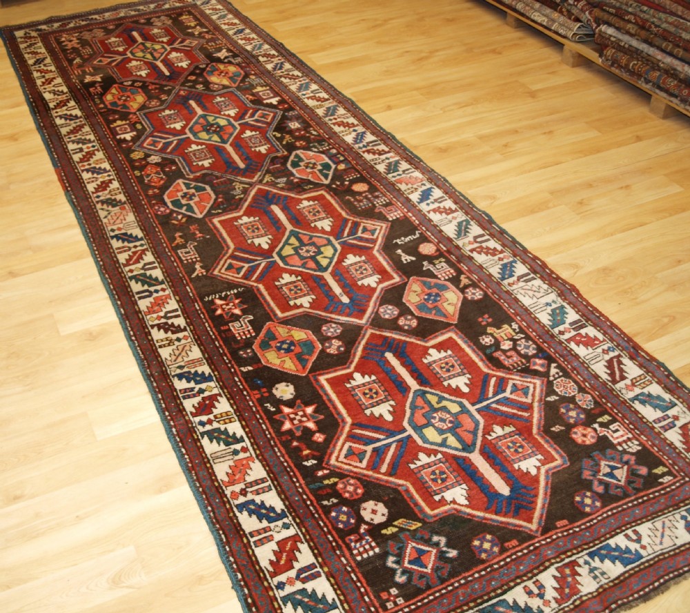 ANTIQUE CAUCASIAN KAZAK RUNNER, SUPERB DESIGN AND COLOUR, CIRCA 1900. View II