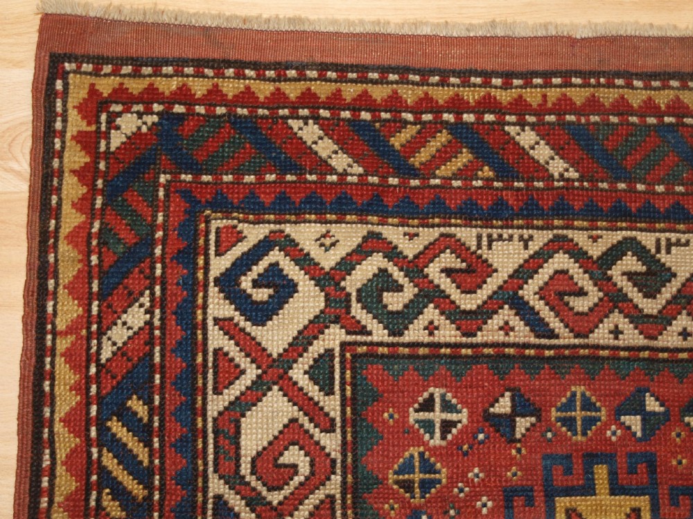 ANTIQUE CAUCASIAN KAZAK RUG WITH MEMLINC GULS, SMALL SIZE, CIRCA 1900. View III