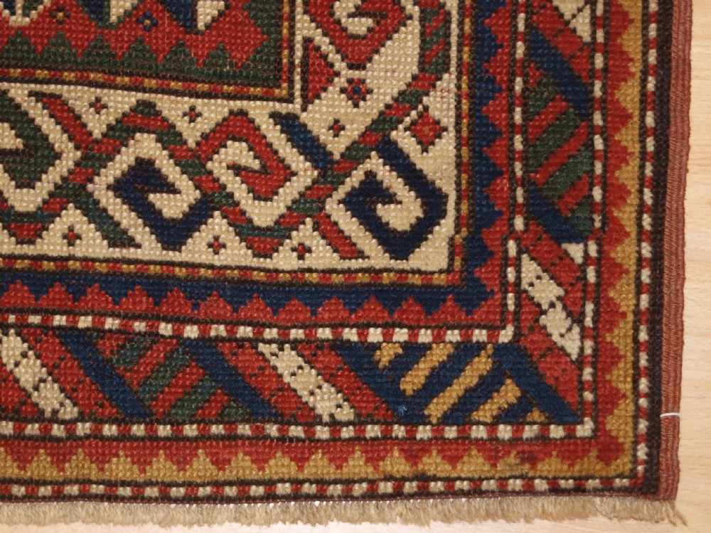 ANTIQUE CAUCASIAN KAZAK RUG WITH MEMLINC GULS, SMALL SIZE, CIRCA 1900. View IX