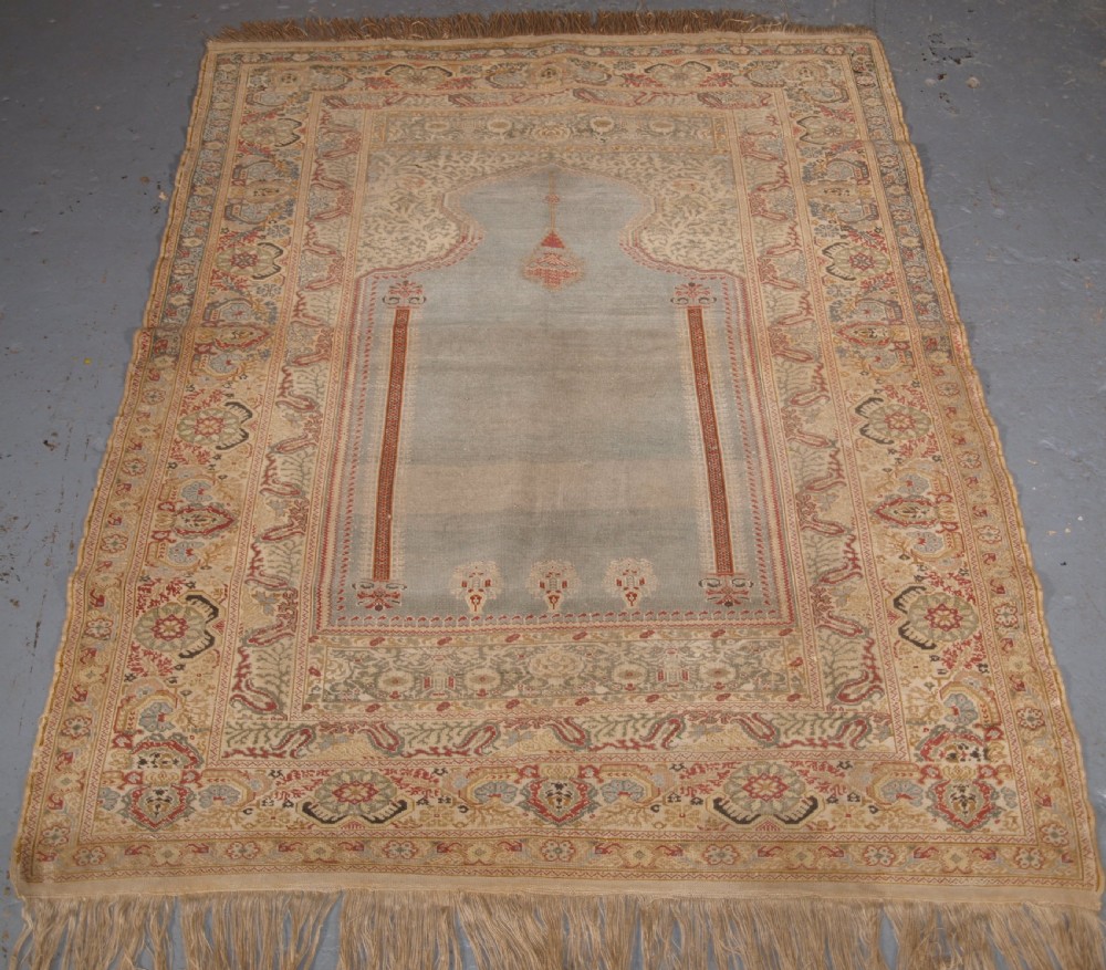 ANTIQUE TURKISH GHIORDES PRAYER RUG, LIGHT BLUE FIELD, CIRCA 1825-1850.