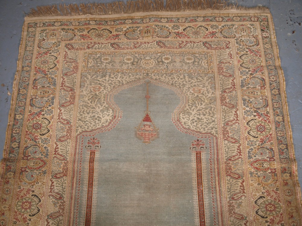 ANTIQUE TURKISH GHIORDES PRAYER RUG, LIGHT BLUE FIELD, CIRCA 1825-1850. View II