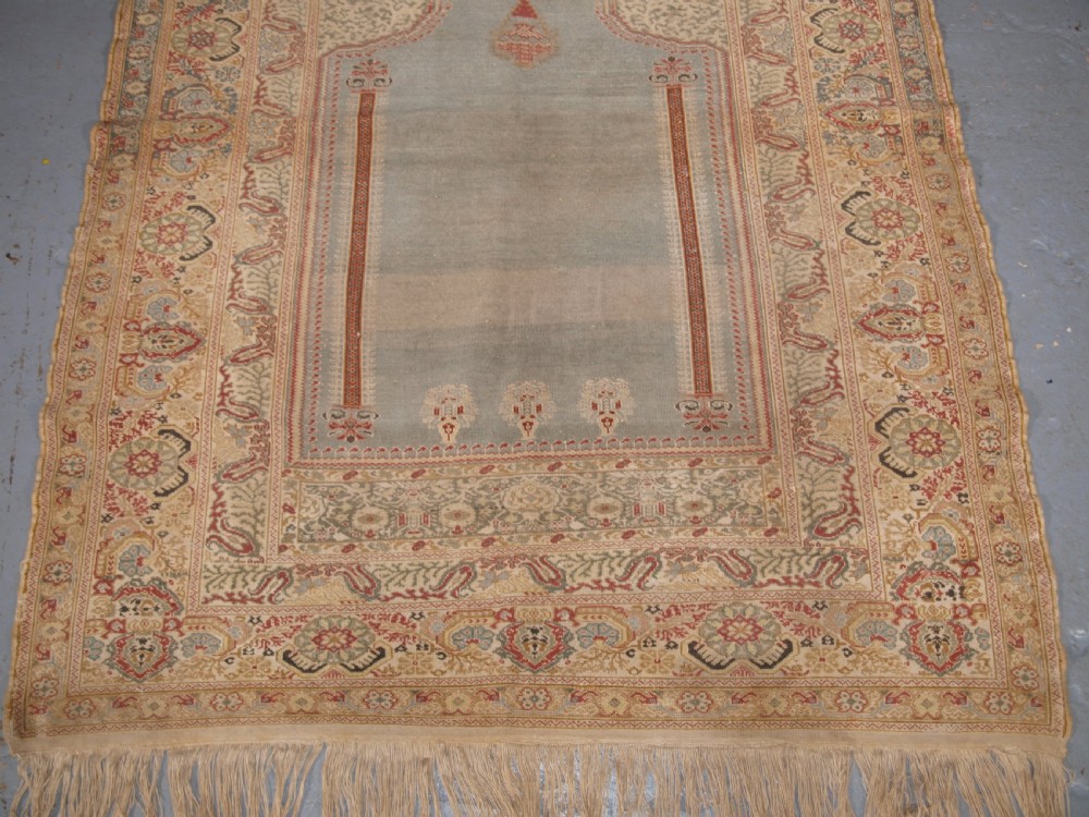 ANTIQUE TURKISH GHIORDES PRAYER RUG, LIGHT BLUE FIELD, CIRCA 1825-1850. View VI