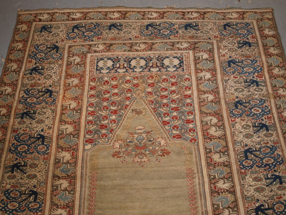 ANTIQUE TURKISH GHIORDES PRAYER RUG, GREEN GROUND, EARLY FORM, CIRCA 1750. View III