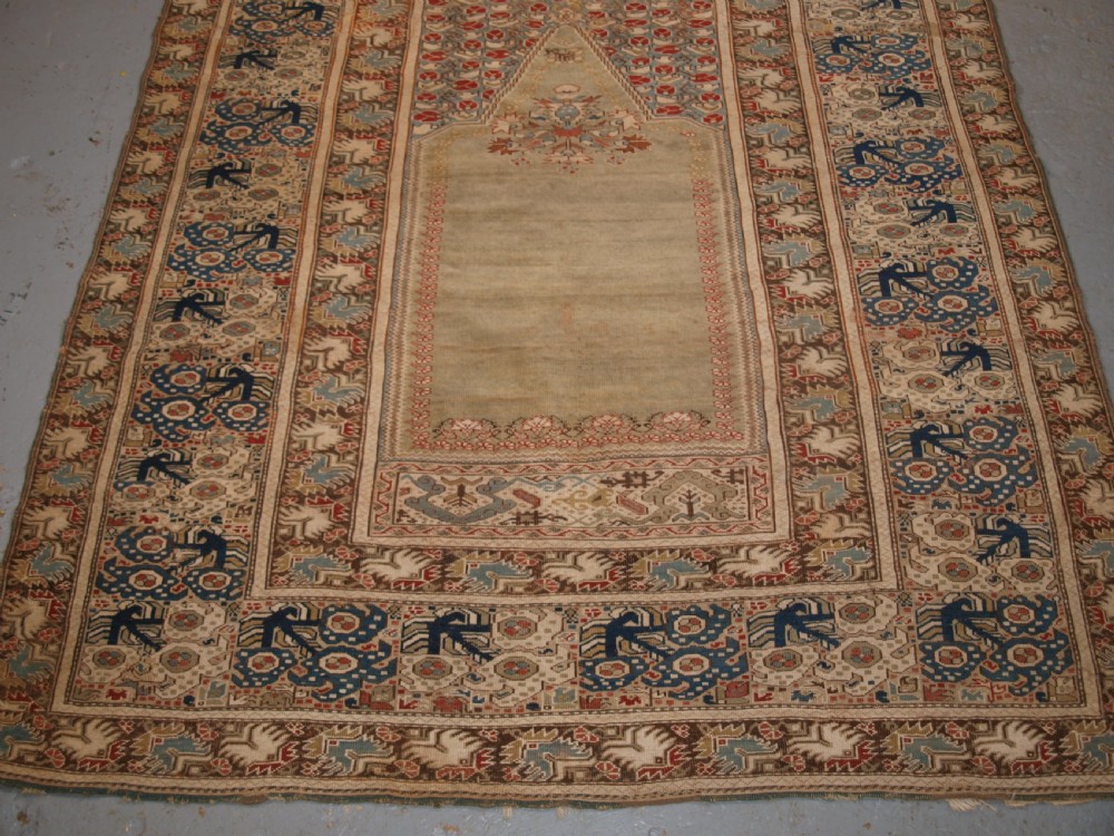 ANTIQUE TURKISH GHIORDES PRAYER RUG, GREEN GROUND, EARLY FORM, CIRCA 1750. View IV