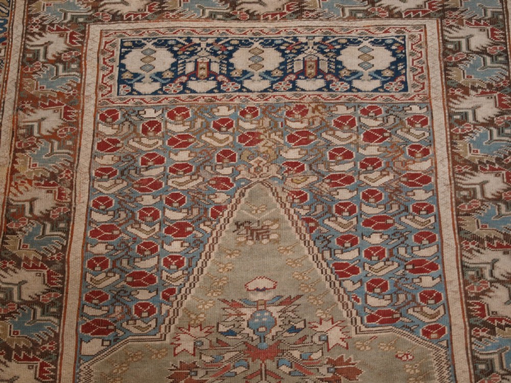 ANTIQUE TURKISH GHIORDES PRAYER RUG, GREEN GROUND, EARLY FORM, CIRCA 1750. View VI