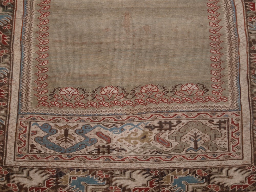 ANTIQUE TURKISH GHIORDES PRAYER RUG, GREEN GROUND, EARLY FORM, CIRCA 1750. View VIII