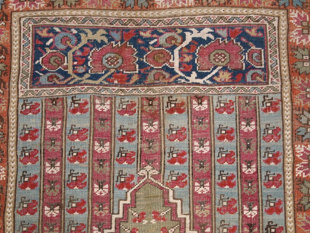 ANTIQUE TURKISH GHIORDES PRAYER RUG, MULTIPLE BORDERS, GREEN FIELD, CIRCA 1800. View VI