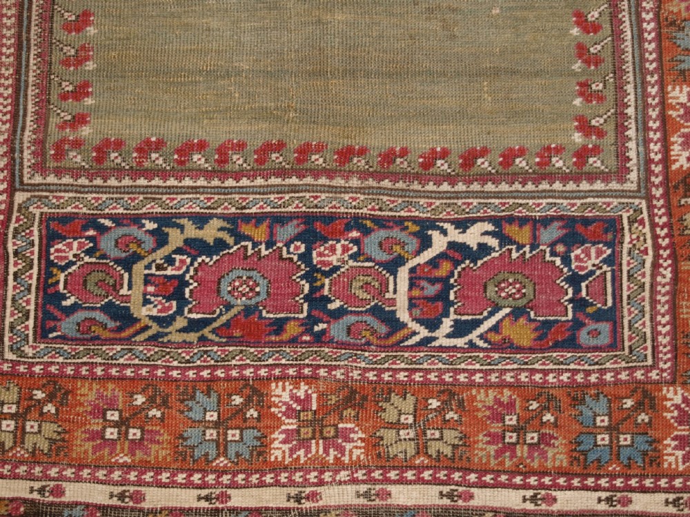 ANTIQUE TURKISH GHIORDES PRAYER RUG, MULTIPLE BORDERS, GREEN FIELD, CIRCA 1800. View IX