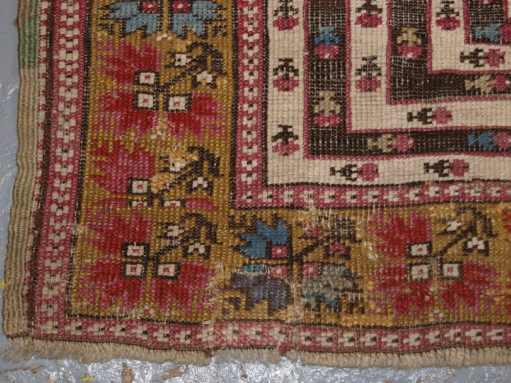 ANTIQUE TURKISH GHIORDES PRAYER RUG, MULTIPLE BORDERS, GREEN FIELD, CIRCA 1800. View X