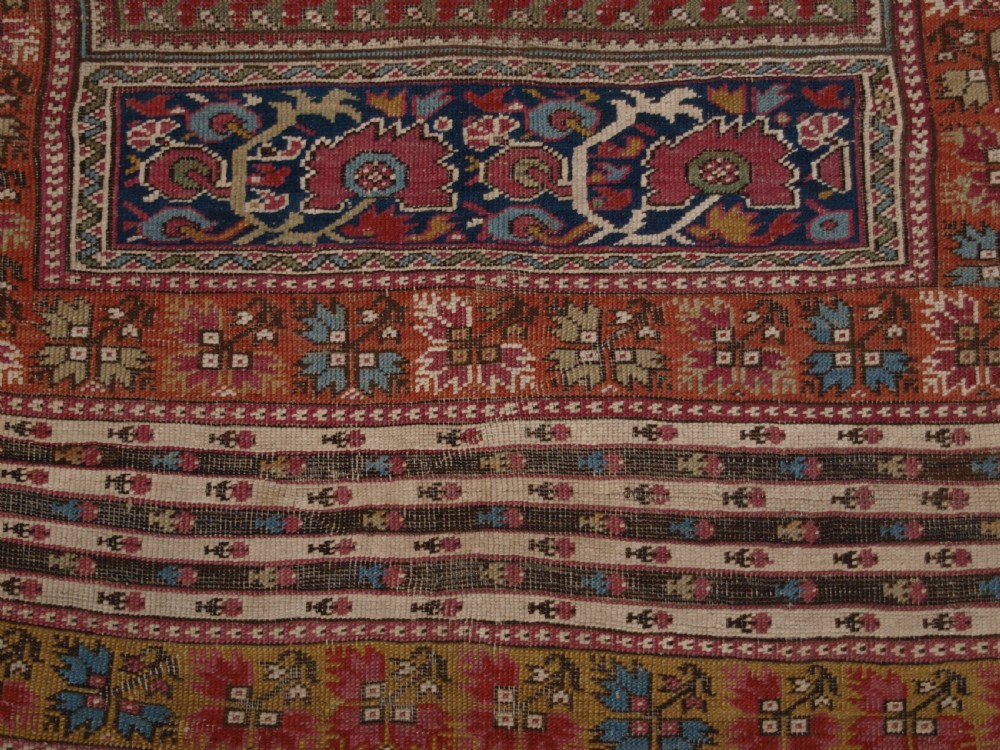 ANTIQUE TURKISH GHIORDES PRAYER RUG, MULTIPLE BORDERS, GREEN FIELD, CIRCA 1800. View XII