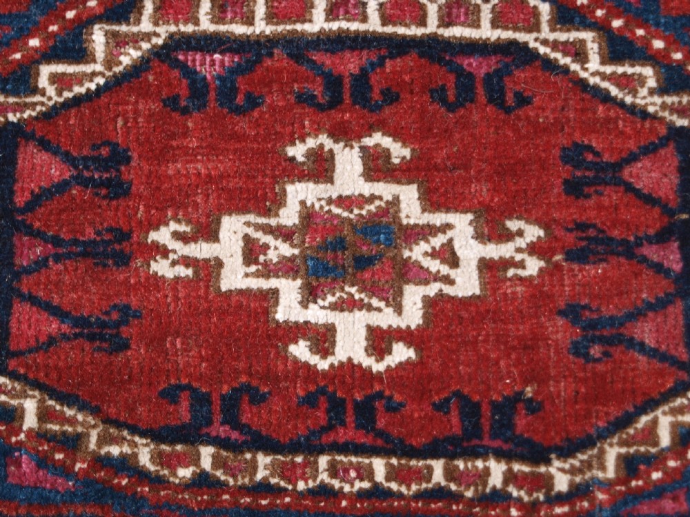 ANTIQUE TEKKE TURKMEN CHUVAL, SILK AND COTTON HIGHLIGHTS, SALOR GULS, CIRCA 1825. View VIII