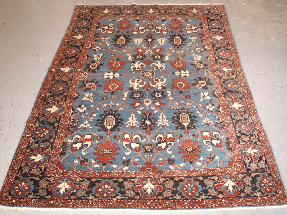 ANTIQUE TABRIZ RUG WITH SAFAVID INSPIRED VASE DESIGN, CIRCA 1920.