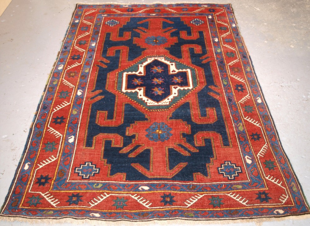 ANTIQUE CAUCASIAN KUBA REGION RUG WITH GYMYL DESIGN, CIRCA 1900.