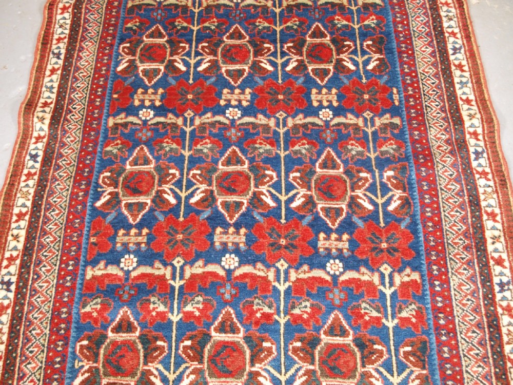ANTIQUE AFSHAR RUG WITH UNUSUAL LARGE FLOWER DESIGN, CIRCA 1900. View III