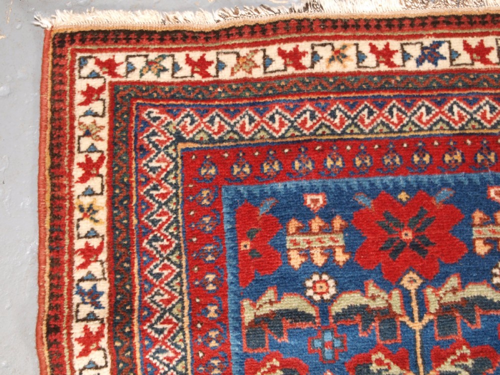 ANTIQUE AFSHAR RUG WITH UNUSUAL LARGE FLOWER DESIGN, CIRCA 1900. View V