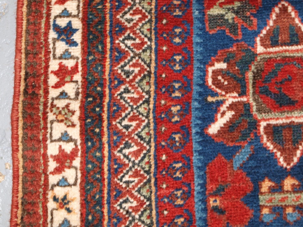 ANTIQUE AFSHAR RUG WITH UNUSUAL LARGE FLOWER DESIGN, CIRCA 1900. View VI