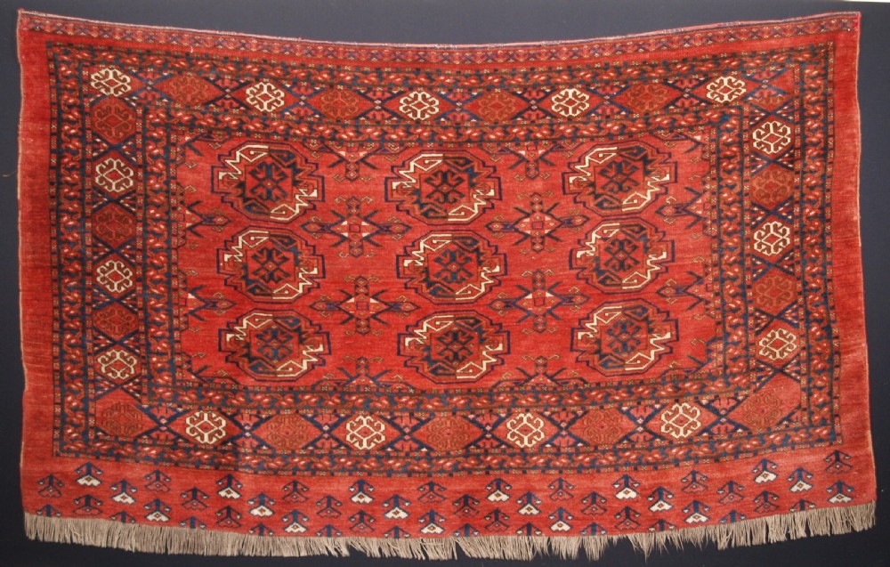 ANTIQUE KIZIL AYAK TURKMEN 9 GUL CHUVAL OF LARGE SIZE, CIRCA 1900.