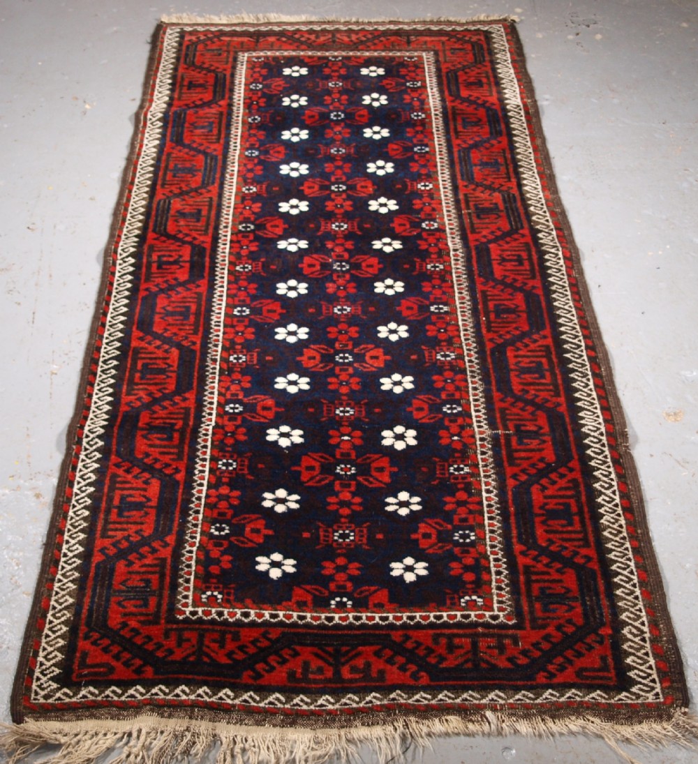 ANTIQUE BALUCH RUG WITH MINA KHANI DESIGN, EXCELLENT CONDITION, CIRCA 1900.