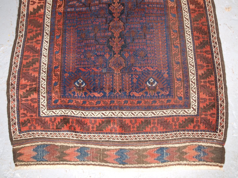 ANTIQUE TIMURI BALUCH RUG WITH BLUE GROUND AND TREE OF LIFE, CIRCA 1880. View V