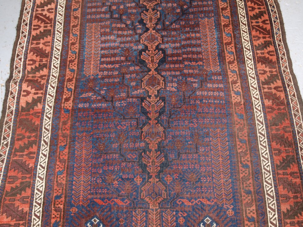 ANTIQUE TIMURI BALUCH RUG WITH BLUE GROUND AND TREE OF LIFE, CIRCA 1880. View VI