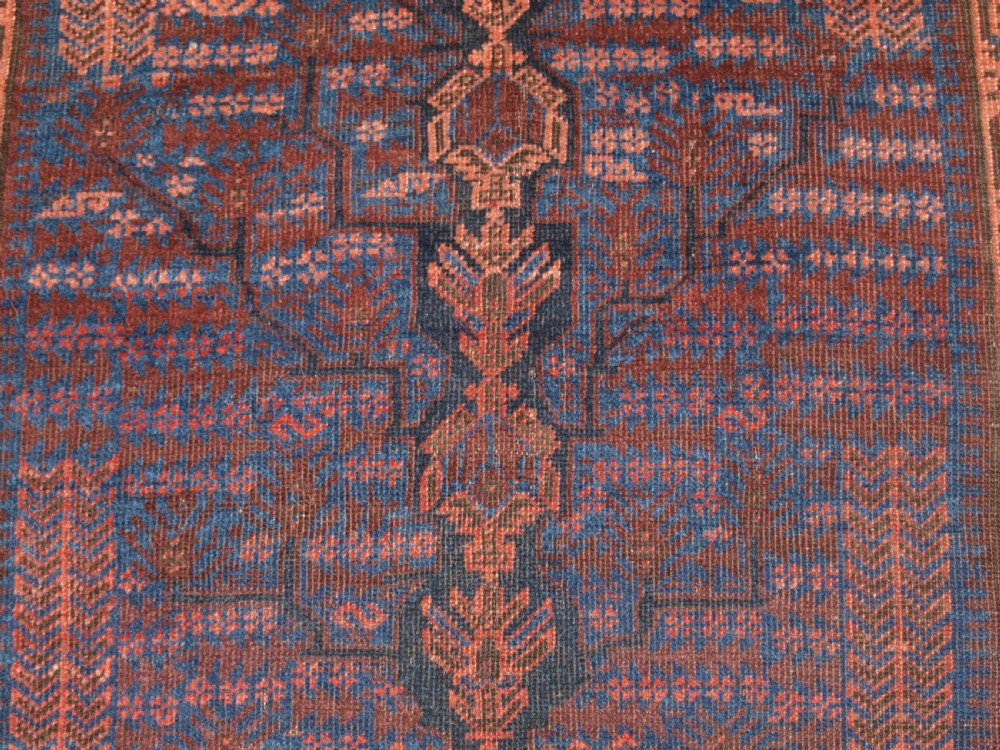 ANTIQUE TIMURI BALUCH RUG WITH BLUE GROUND AND TREE OF LIFE, CIRCA 1880. View IX