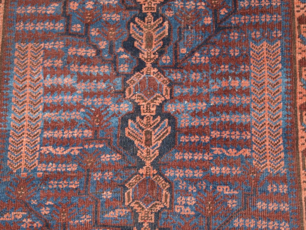 ANTIQUE TIMURI BALUCH RUG WITH BLUE GROUND AND TREE OF LIFE, CIRCA 1880. View X