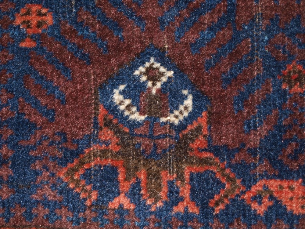 ANTIQUE TIMURI BALUCH RUG WITH BLUE GROUND AND TREE OF LIFE, CIRCA 1880. View XVI