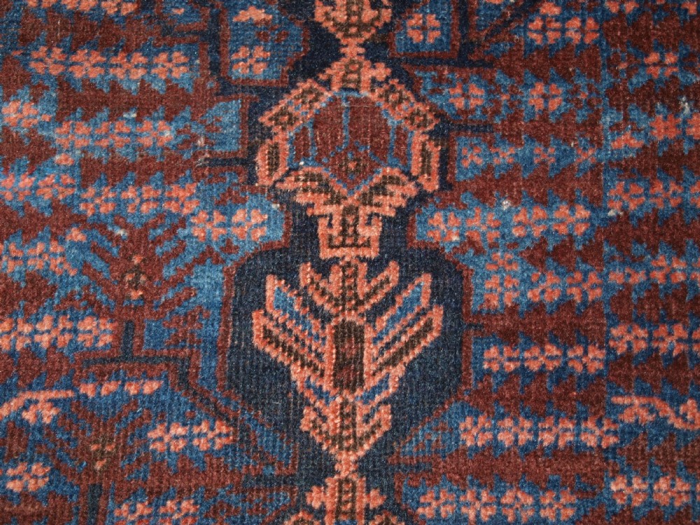 ANTIQUE TIMURI BALUCH RUG WITH BLUE GROUND AND TREE OF LIFE, CIRCA 1880. View XVII