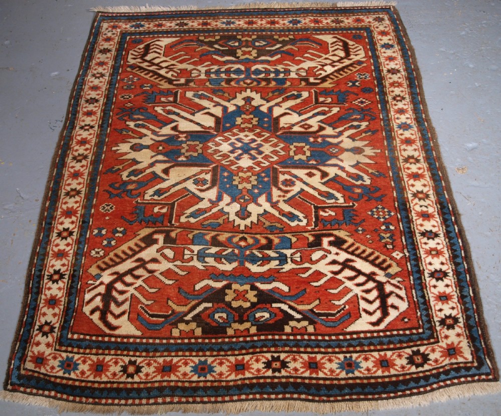ANTIQUE CAUCASIAN CHELABERD KAZAK SINGLE MEDALLION RUG OF SMALL SIZE, CIRCA 1880.