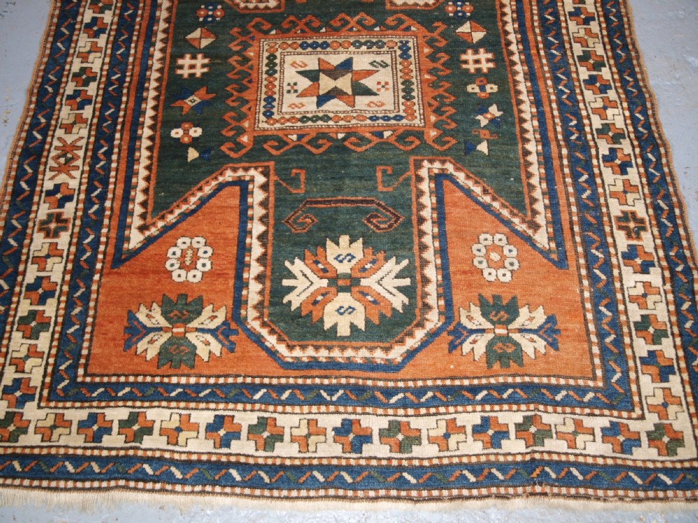 ANTIQUE CAUCASIAN SEWAN KAZAK RUG WITH GREEN GROUND MEDALLION, CIRCA 1890. View V