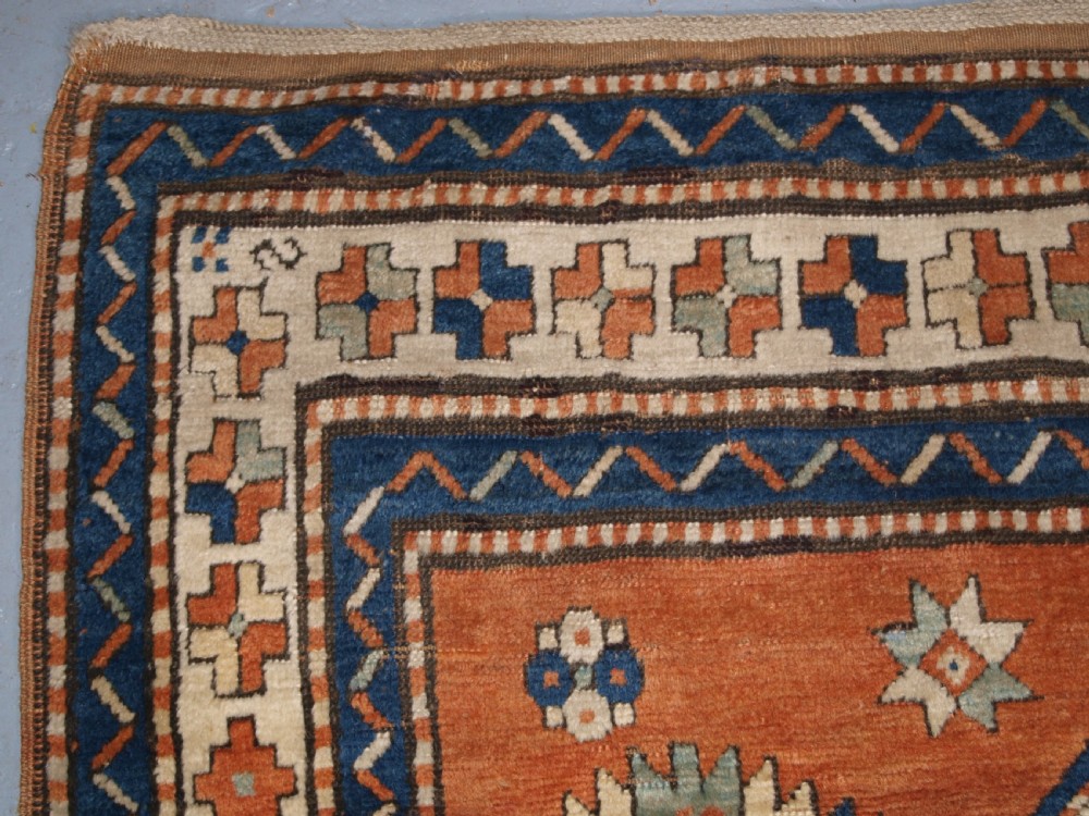 ANTIQUE CAUCASIAN SEWAN KAZAK RUG WITH GREEN GROUND MEDALLION, CIRCA 1890. View VI