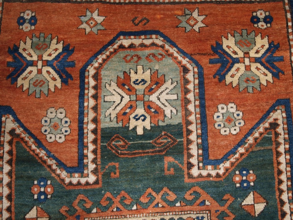 ANTIQUE CAUCASIAN SEWAN KAZAK RUG WITH GREEN GROUND MEDALLION, CIRCA 1890. View VIII