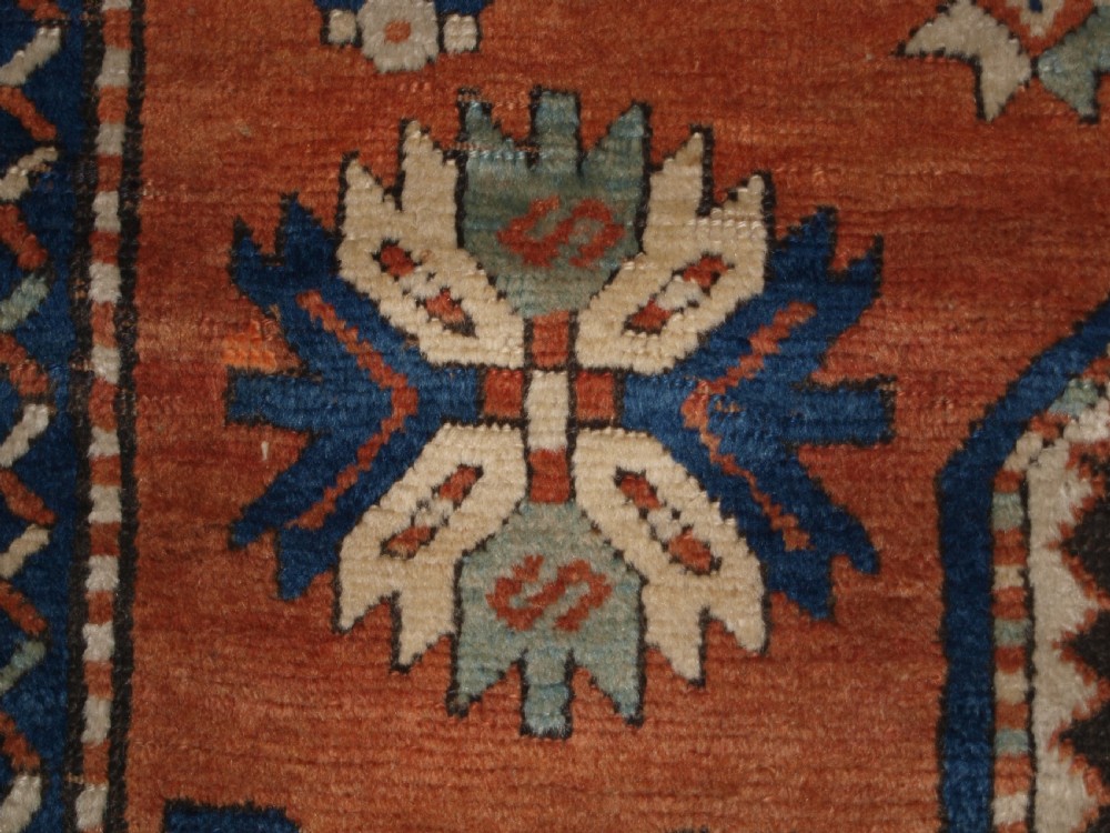 ANTIQUE CAUCASIAN SEWAN KAZAK RUG WITH GREEN GROUND MEDALLION, CIRCA 1890. View X