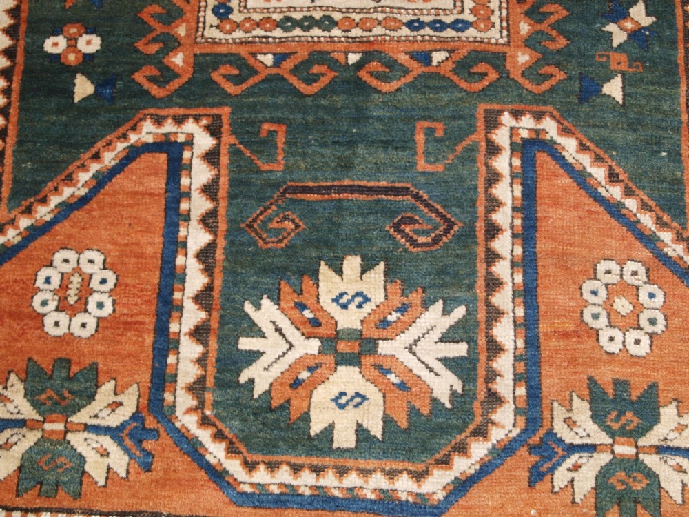 ANTIQUE CAUCASIAN SEWAN KAZAK RUG WITH GREEN GROUND MEDALLION, CIRCA 1890. View XI