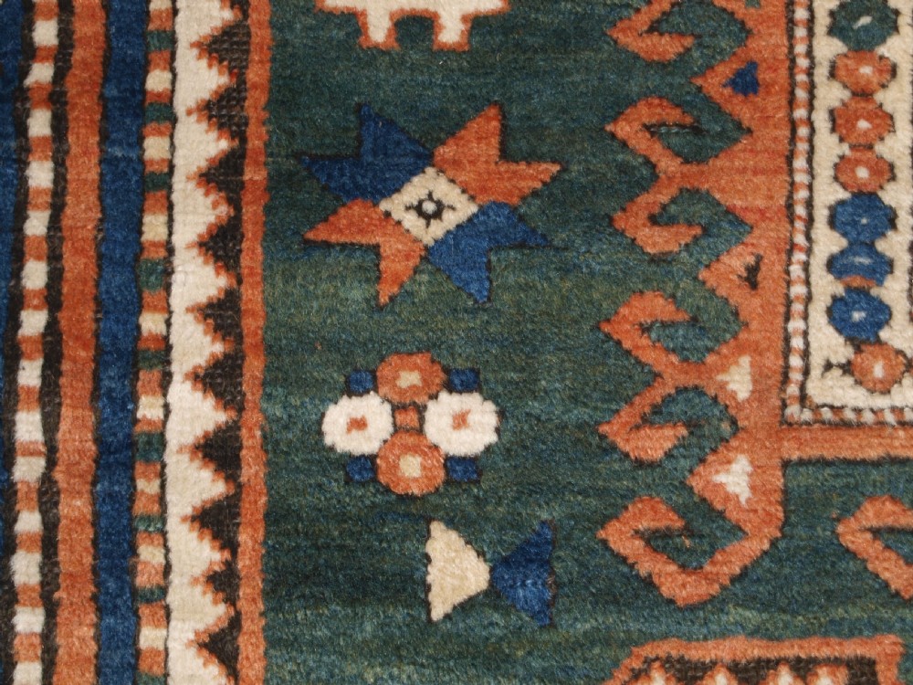 ANTIQUE CAUCASIAN SEWAN KAZAK RUG WITH GREEN GROUND MEDALLION, CIRCA 1890. View XIII