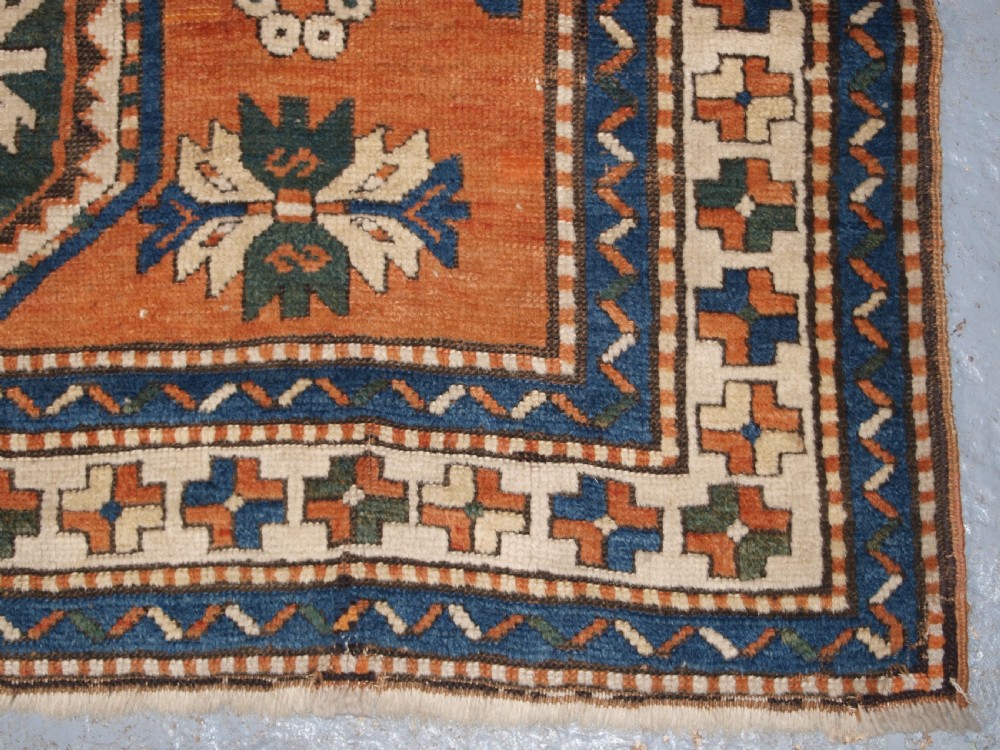 ANTIQUE CAUCASIAN SEWAN KAZAK RUG WITH GREEN GROUND MEDALLION, CIRCA 1890. View XV