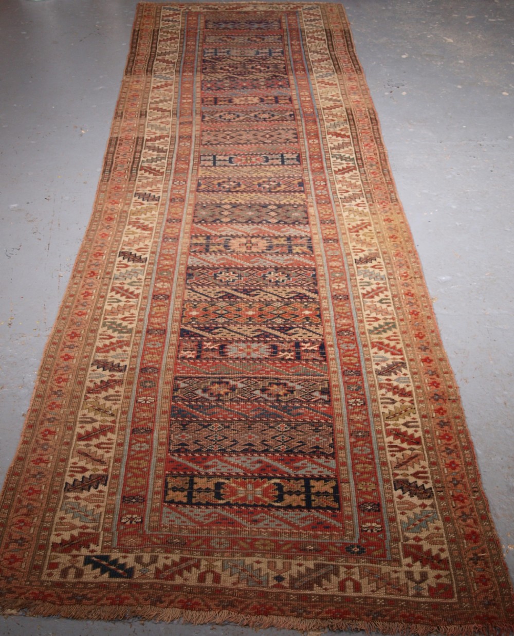 ANTIQUE SOUTH CAUCASIAN KURDISH RUNNER OF UNUSUAL DESIGN, CIRCA 1890.