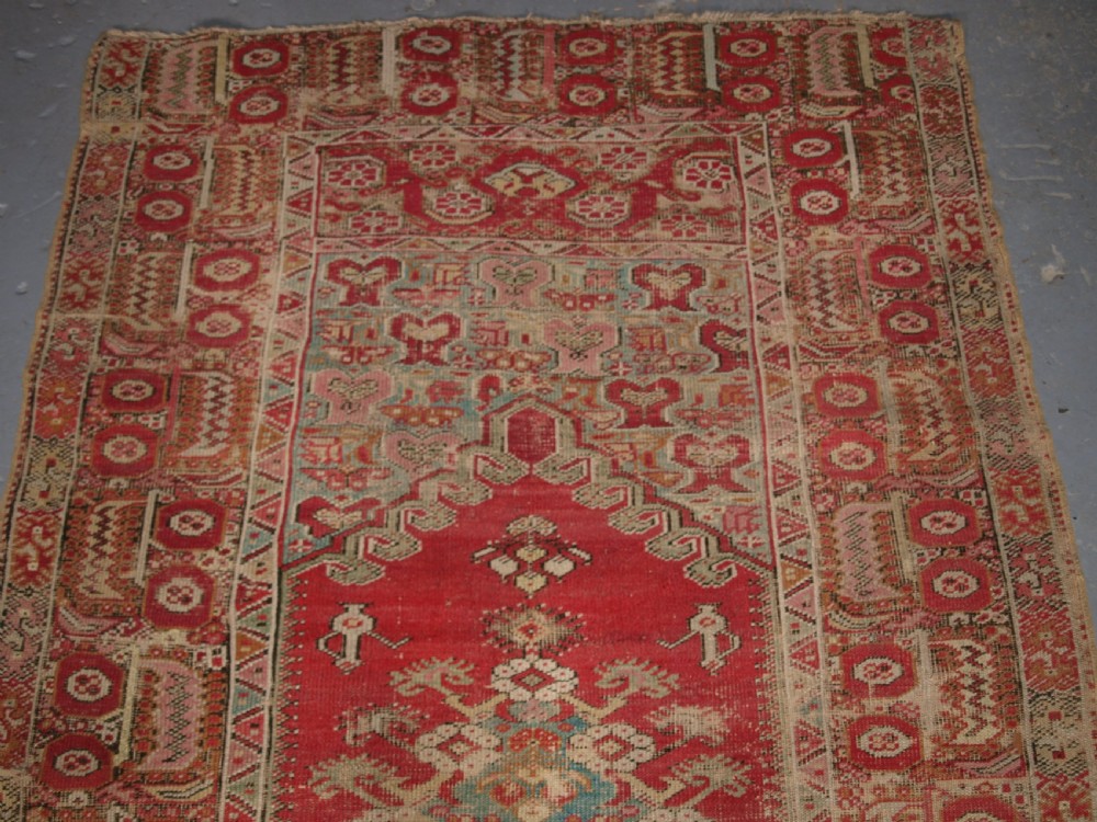 ANTIQUE TURKISH GHIORDES RUG, SOFT COLOURS, LATE 18TH / EARLY 19TH CENTURY. View III