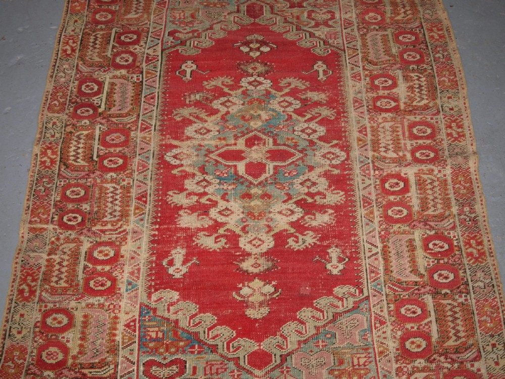 ANTIQUE TURKISH GHIORDES RUG, SOFT COLOURS, LATE 18TH / EARLY 19TH CENTURY. View IV