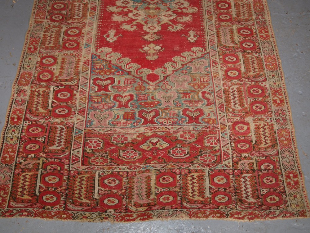 ANTIQUE TURKISH GHIORDES RUG, SOFT COLOURS, LATE 18TH / EARLY 19TH CENTURY. View V