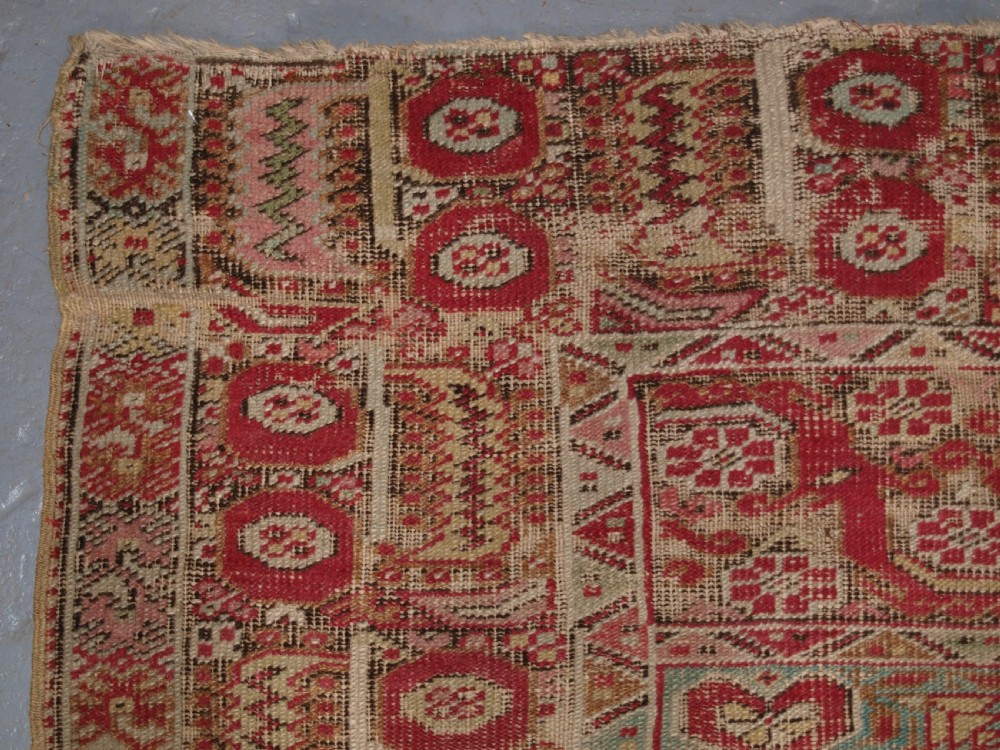 ANTIQUE TURKISH GHIORDES RUG, SOFT COLOURS, LATE 18TH / EARLY 19TH CENTURY. View VI