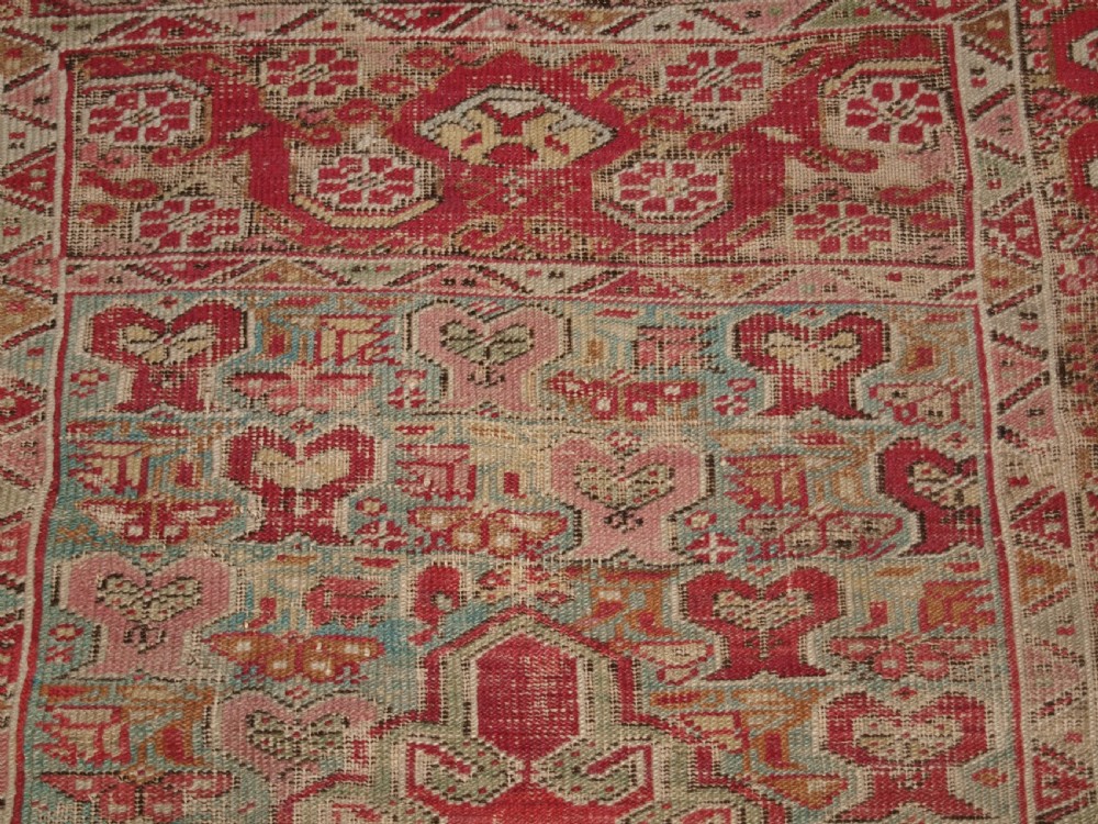 ANTIQUE TURKISH GHIORDES RUG, SOFT COLOURS, LATE 18TH / EARLY 19TH CENTURY. View IX
