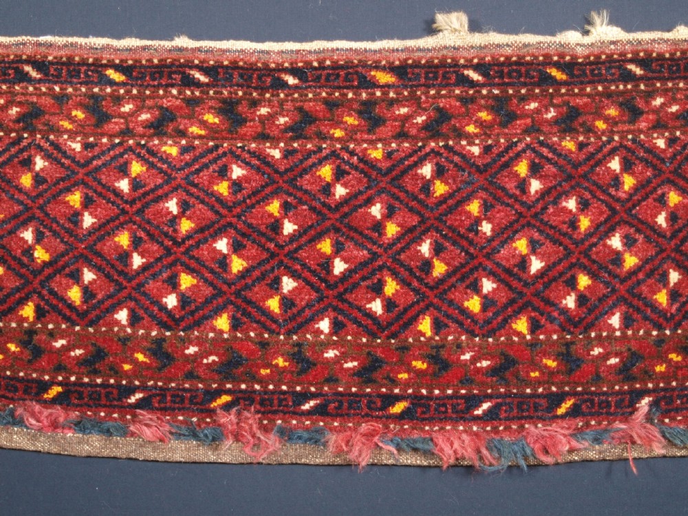 ANTIQUE ERSARI BESHIR TORBA WITH DIAMOND LATTICE DESIGN, CIRCA 1900. View IV