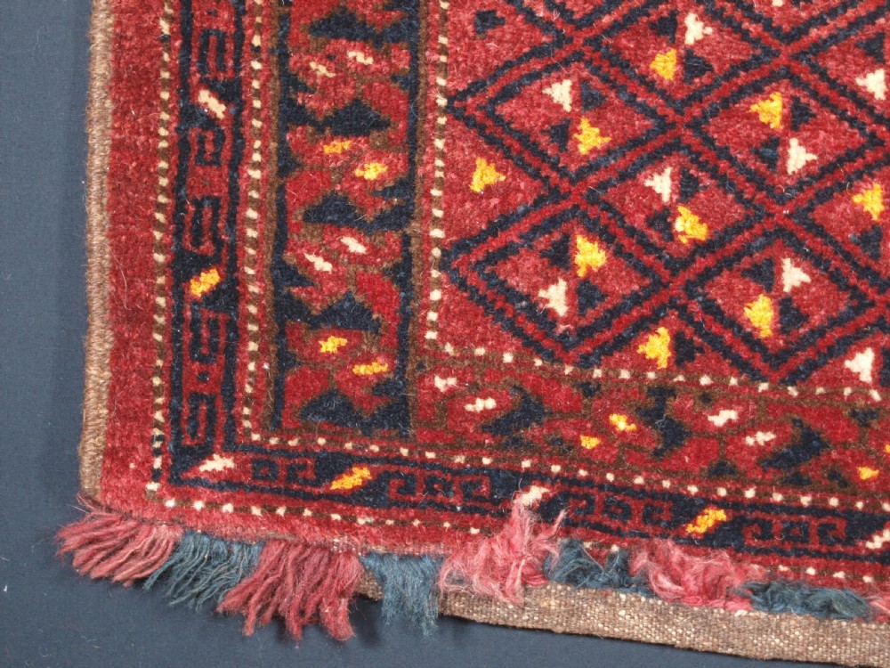ANTIQUE ERSARI BESHIR TORBA WITH DIAMOND LATTICE DESIGN, CIRCA 1900. View VI