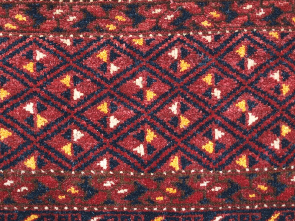 ANTIQUE ERSARI BESHIR TORBA WITH DIAMOND LATTICE DESIGN, CIRCA 1900. View VIII