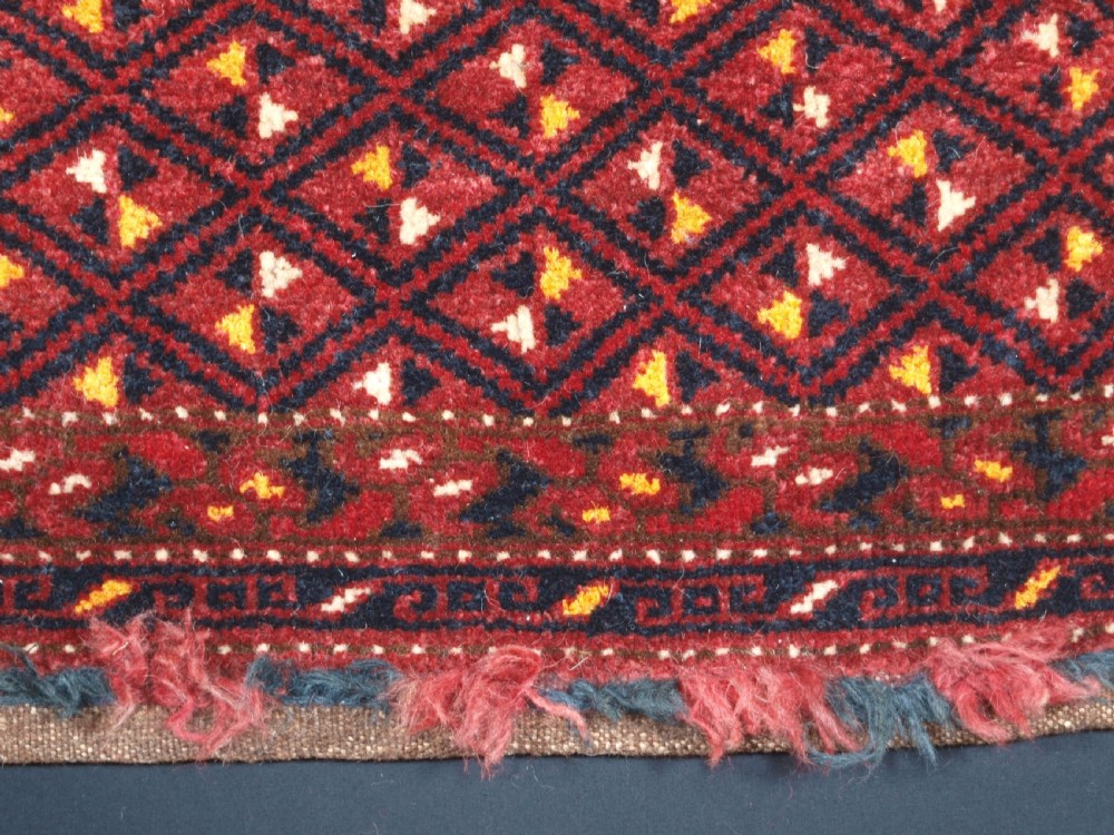 ANTIQUE ERSARI BESHIR TORBA WITH DIAMOND LATTICE DESIGN, CIRCA 1900. View X